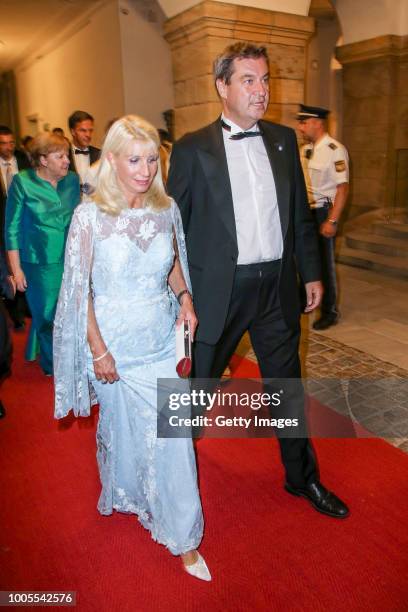 Bavarian State prime Minister Markus Soeder and his wife Karin Baumueller attend the Bayreuth Festival 2018 state reception at Neues Schloss on July...