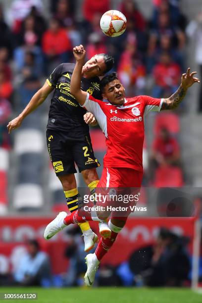 Efrain Velarde of Morelia struggles for the ball with Ernesto Vega of Toluca during the 1st round match between Toluca and Morelia as part of the...