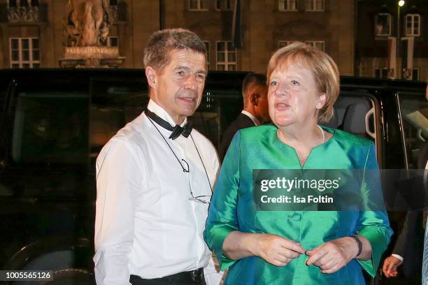 German Federal Chancellor Angela Merkel and her husband Joachim Sauer attend the Bayreuth Festival 2018 state reception at Neues Schloss on July 25,...