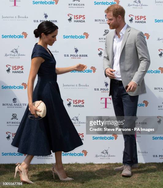 The Duke and Duchess of Sussex arrive for the Sentebale ISPS Handa Polo Cup at the Royal County of Berkshire Polo Club in Windsor.