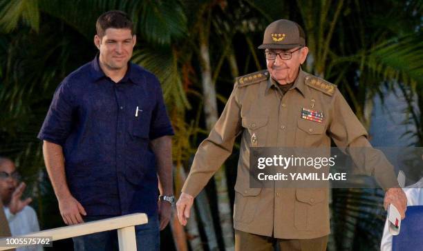 Cuban former President and first secretary of the Cuban Communist Party, Raul Castro , escorted by his grandson and bodyguard Raul Guillermo...