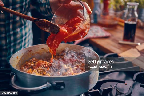 preparing homemade spaghetti bolognese - pasta tomato basil stock pictures, royalty-free photos & images