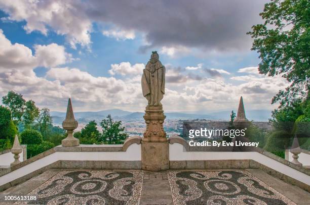 view of braga city and statue from the steps of the five senses, braga, portugal - braga city stock pictures, royalty-free photos & images