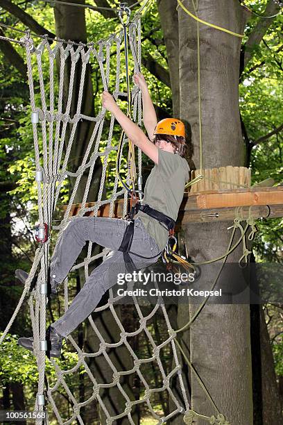 Climber Sven in action during a climbing session at the GHW tightrobe climbing garden on May 25, 2010 in Hueckeswagen, Germany.