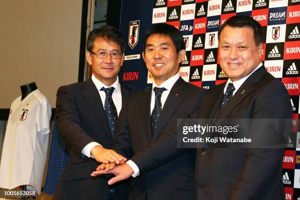 Technical director Takashi Sekizuka and Japan national team new head coach Hajime Moriyasu and Football Association President KozoTashima attend a...