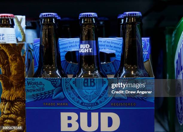 Six pack of Bud Light sits on a shelf for sale at a convenience store, July 26, 2018 in New York City. Anheuser-Busch InBev, the brewer behind...