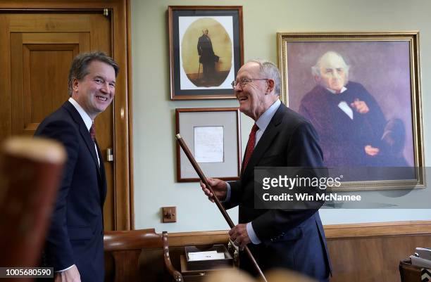 Sen. Lamar Alexander shows off a walking stick that belonged to Sam Houston while meeting with Supreme Court nominee Judge Brett Kavanaugh in his...