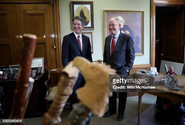 With his collection of walking sticks in the foreground, Sen. Lamar Alexander meets with Supreme Court nominee Judge Brett Kavanaugh in his office on...
