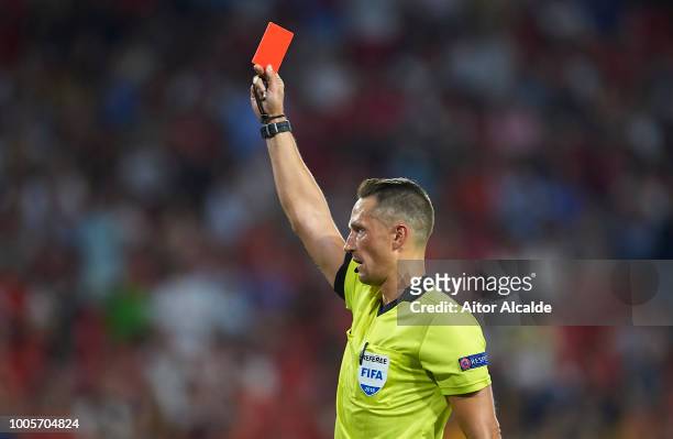 Letonian referee Andris Treimanis shows red card to Pauljevic of Ujpest during Sevilla v Ujpest UEFA Europa League Second Qualifying Round 1st leg...