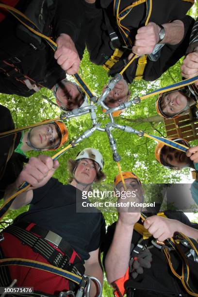 Team of climbers come together at the GHW tightrobe climbing garden on May 25, 2010 in Hueckeswagen, Germany.