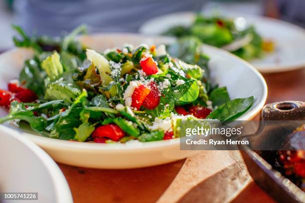 spinach salad with strawberries, goat cheese, balsamic, and walnuts - salad stock pictures, royalty-free photos & images