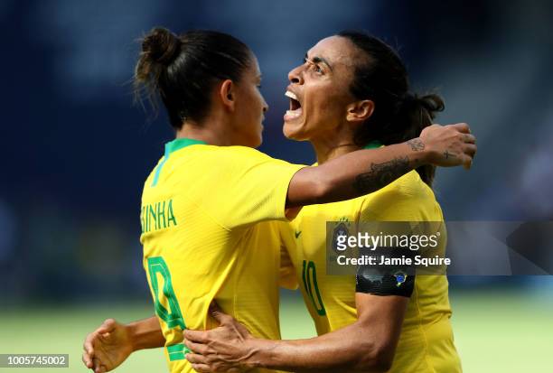 Marta of Brazil celebrates with Debinha after a goal during their Tournament of Nations match against Australia at Children's Mercy Park on July 26,...