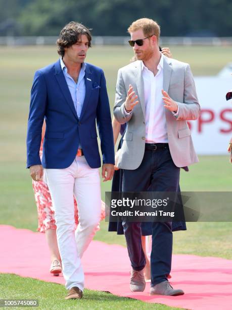 Prince Harry, Duke of Sussex and Nacho Figuares attend the Sentebale ISPS Handa Polo Cup at the Royal County of Berkshire Polo Club on July 26, 2018...