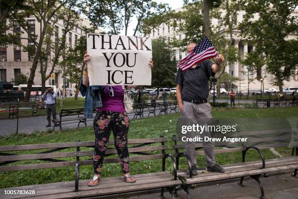 Counter-demonstrators supporting President Donald Trump rally across the street from activists rallying against the Trump administration's...