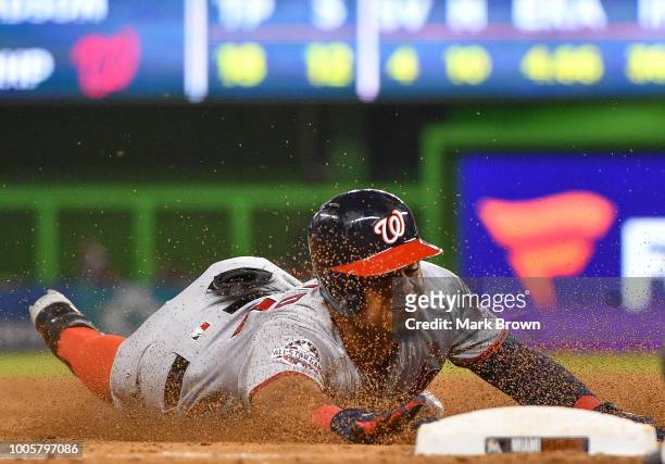 Wilmer Difo of the Washington Nationals triples in the ninth inning against the Miami Marlins at Marlins Park on July 26, 2018 in Miami, Florida.