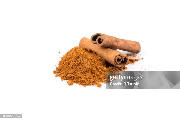 cinnamon sticks with powder isolated on white background - spice powder stock pictures, royalty-free photos & images