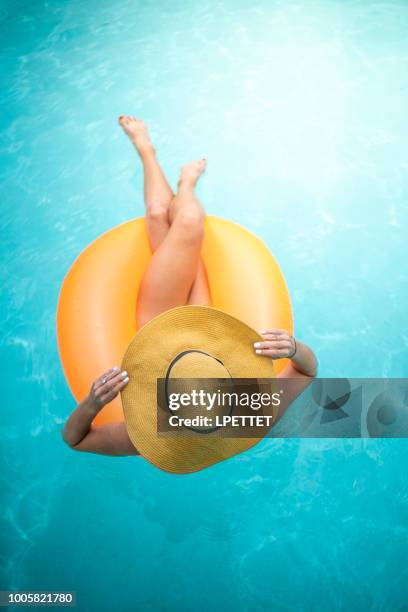 summer swimming pool fun - inflatable ring stock pictures, royalty-free photos & images