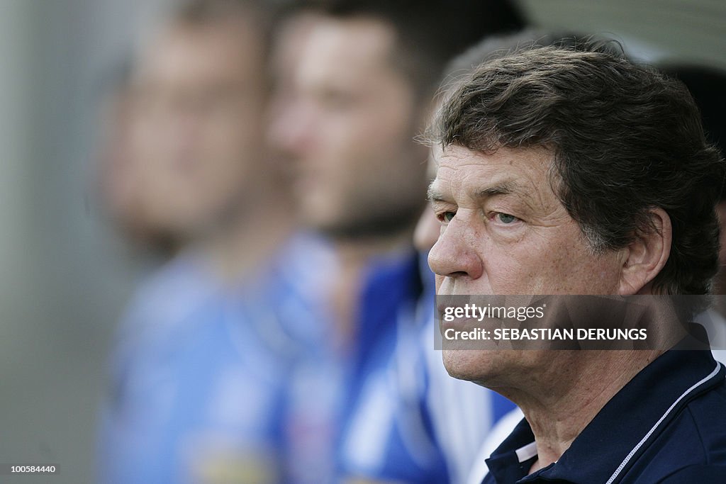 Greece's coach Otto Rehhagel observes a