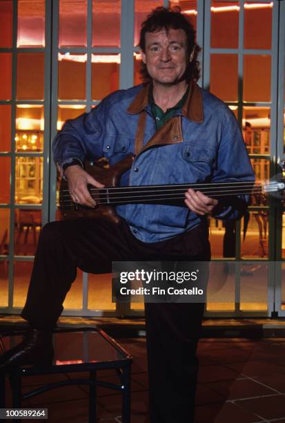 Jack Bruce poses with a bass guitar circa 1990.