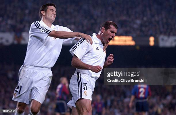 Zinedine Zidane of Real Madrid celebrates with Santiago Solari after scoring the first goal during the UEFA Champions League Semi Final First Leg...