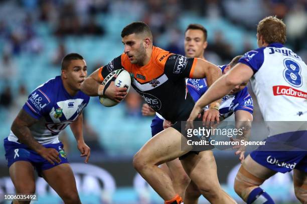 Alex Twal of the Tigers makes a break during the round 20 NRL match between the Canterbury Bulldogs and the Wests Tigers at ANZ Stadium on July 27,...