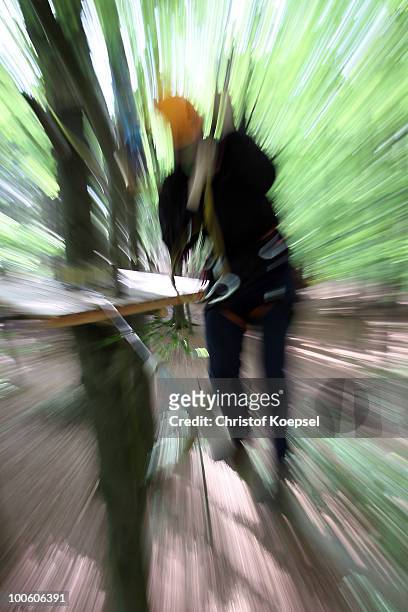 Climber in action during a climbing at the GHW tightrobe climbing garden on May 25, 2010 in Hueckeswagen, Germany.