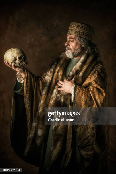 hamlet by william shakespear holding skull in his hands - medieval man stock pictures, royalty-free photos & images