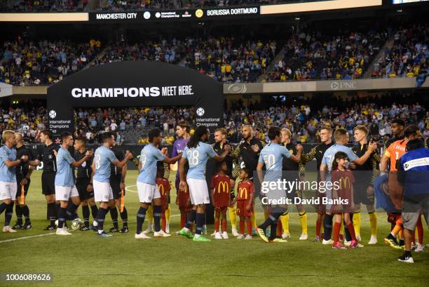 Players walk onto the pitch before the game between Manchester City and Borussia Dortmund on July 20, 2018 at Soldier Field in Chicago, Illinois.