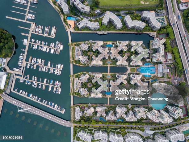 aerial view of keppel bay with modern residence in singapore city. - sentosa island singapore stock pictures, royalty-free photos & images