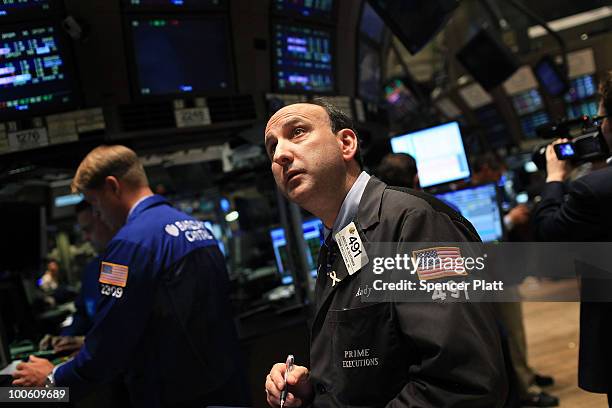 Traders work on the floor of the New York Stock Exchange on May 25, 2010 in New York City. After significant morning losses, the Dow Jones industrial...