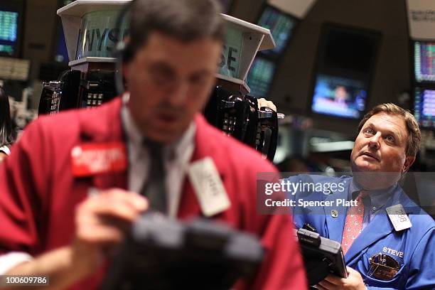 Traders work on the floor of the New York Stock Exchange on May 25, 2010 in New York City. After significant morning losses, the Dow Jones industrial...