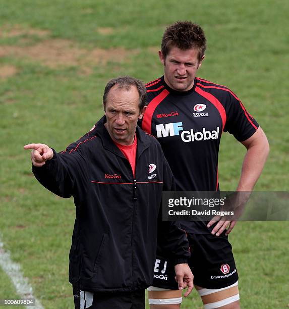 Brendan Venter, the Saracens director of rugby issues instructions watched by his captain Ernst Joubert during the Saracens training session on May...