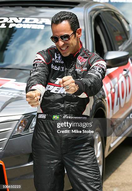 Indy 500 driver Helio Castroneves pose for a photo at Macy's and IZOD's celebration of the Indianapolis Motor Speedway and the Indy 500 at Macy's...