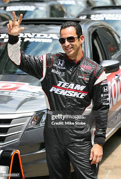 Indy 500 driver Helio Castroneves pose for a photo at Macy's and IZOD's celebration of the Indianapolis Motor Speedway and the Indy 500 at Macy's...