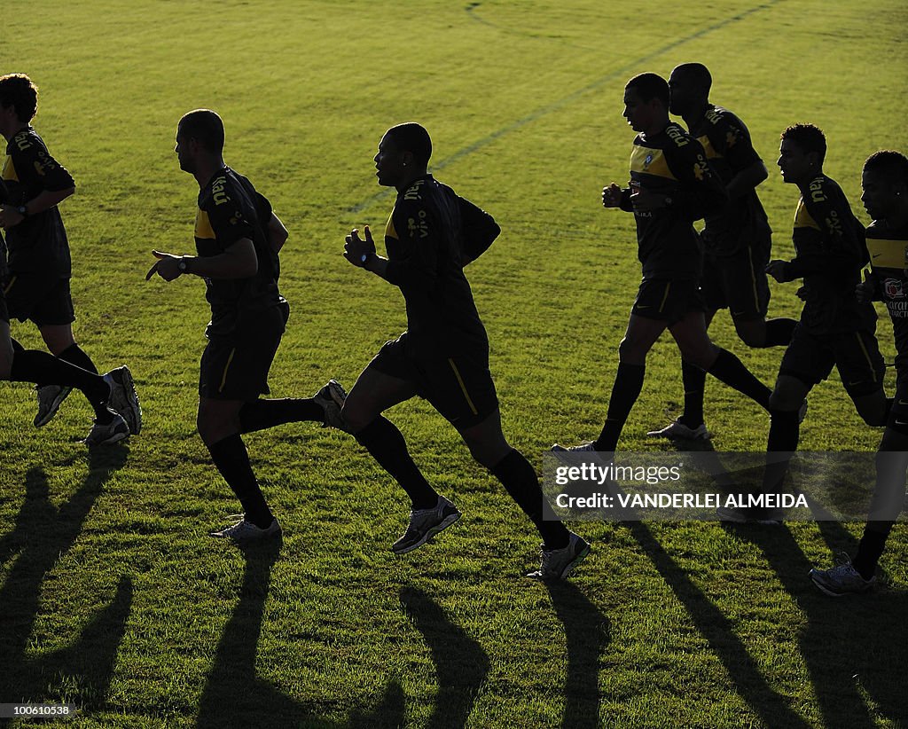 Brazilian players jog during the last da