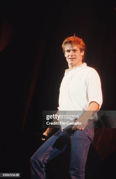 Canadian singer Bryan Adams performs on stage circa 1985.