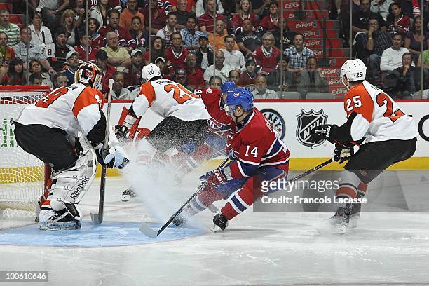 Tomas Plekanec of Montreal Canadiens takes position in front of goalie Michael Leighton of Philadelphia Flyers in Game Four of the Eastern Conference...