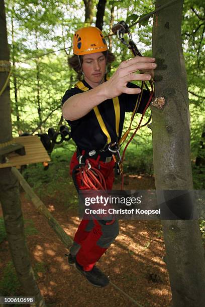 Climber Daniel in action during a climbing session at the GHW tightrobe climbing garden on May 25, 2010 in Hueckeswagen, Germany.