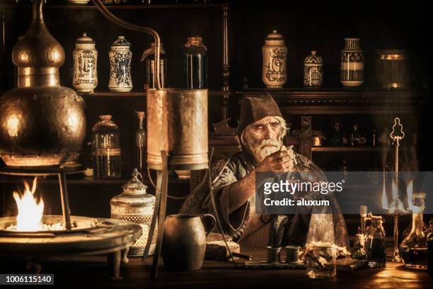 the alchemist - ancient stock pictures, royalty-free photos & images