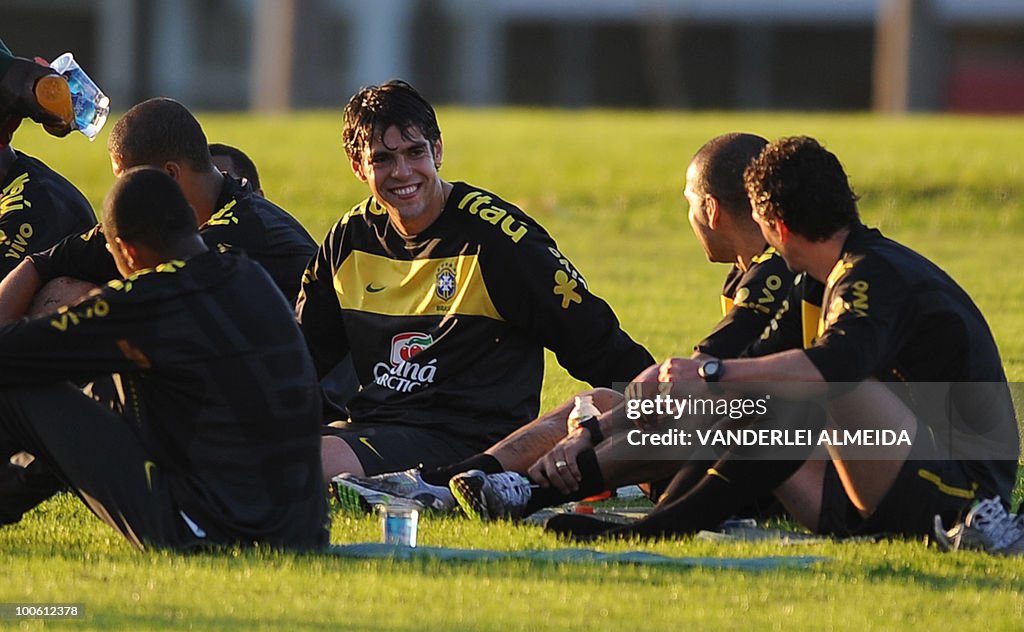 Brazilian player Kaka smiles with Daniel