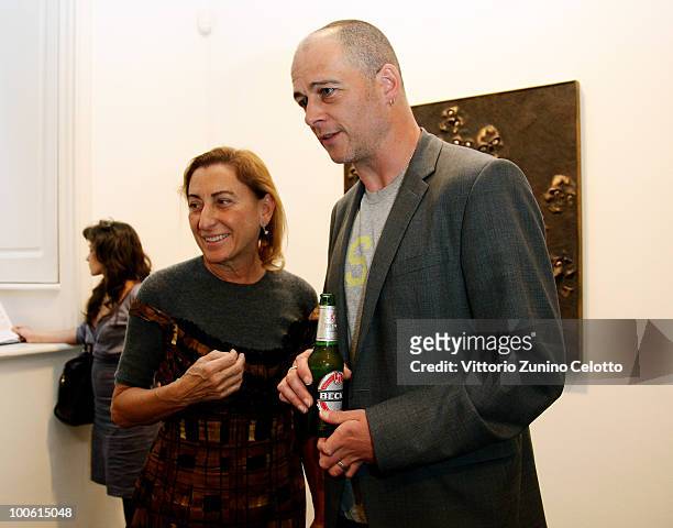 Miuccia Prada and Dinos Chapman attend the Jake And Dinos Chapman Opening At The ProjectB Gallery on May 25, 2010 in Milan, Italy.