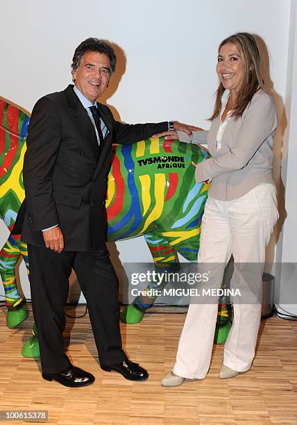 French president of "France Monde" media group, Alain de Pouzilhac and general director of TV5 Monde Marie-Christine Saragosse pose during the...