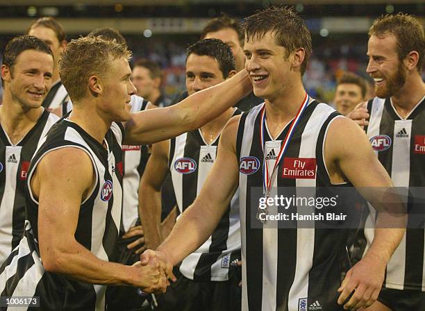 Mark McGough for Collingwood is congratulated by team mates after winning the ANZAC Day Medal, during the Round 5 AFL Anzac Day Match between the...