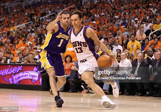 Steve Nash of the Phoenix Suns handles the ball under pressure from Jordan Farmar of the Los Angeles Lakers during Game Three of the Western...