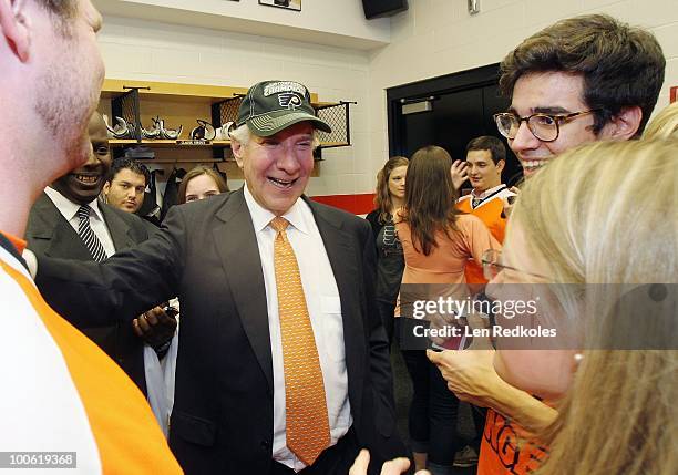 Chairman Ed Snider of the Philadelphia Flyers celebrates with his son Sam Snider after defeating the Montreal Canadiens 4-2 in Game Five of the...