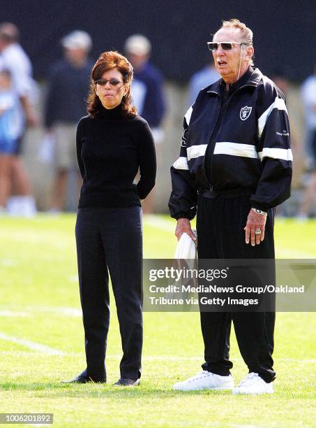 Oakland, CA July 30, 2002: Oakland Raiders Chief Executive Officer, Amy Trask and owner, Al Davis watch a mini training camp season from the...