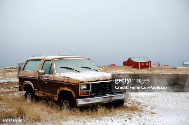 an abandoned car at hafnir, reykjanes peninsula, iceland - rusty car stock-fotos und bilder