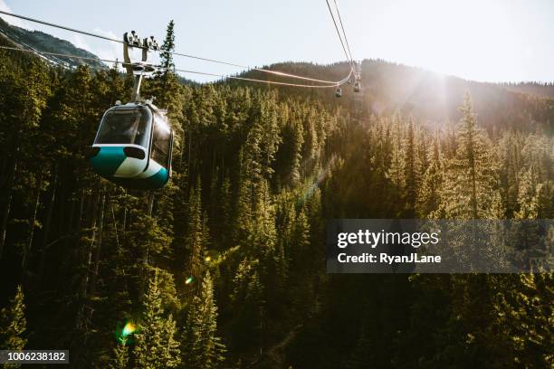 gondola lift going up mountain in banff canada - banff national park stock pictures, royalty-free photos & images