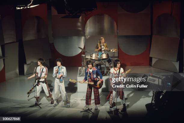 Eric Faulkner, Les McKeown, Alan Longmuir, Derek Longmuir and Stuart Wood of the Bay City Rollers perform on a BBC television show in 1975.