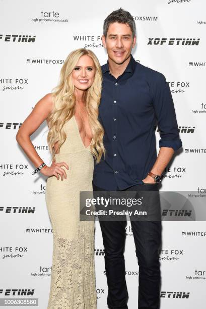Lauren Burnham and Arie Luyendyk attend White Fox Boutique Swimwear Launch Of 100% Salty at Catch on July 26, 2018 in West Hollywood, California.